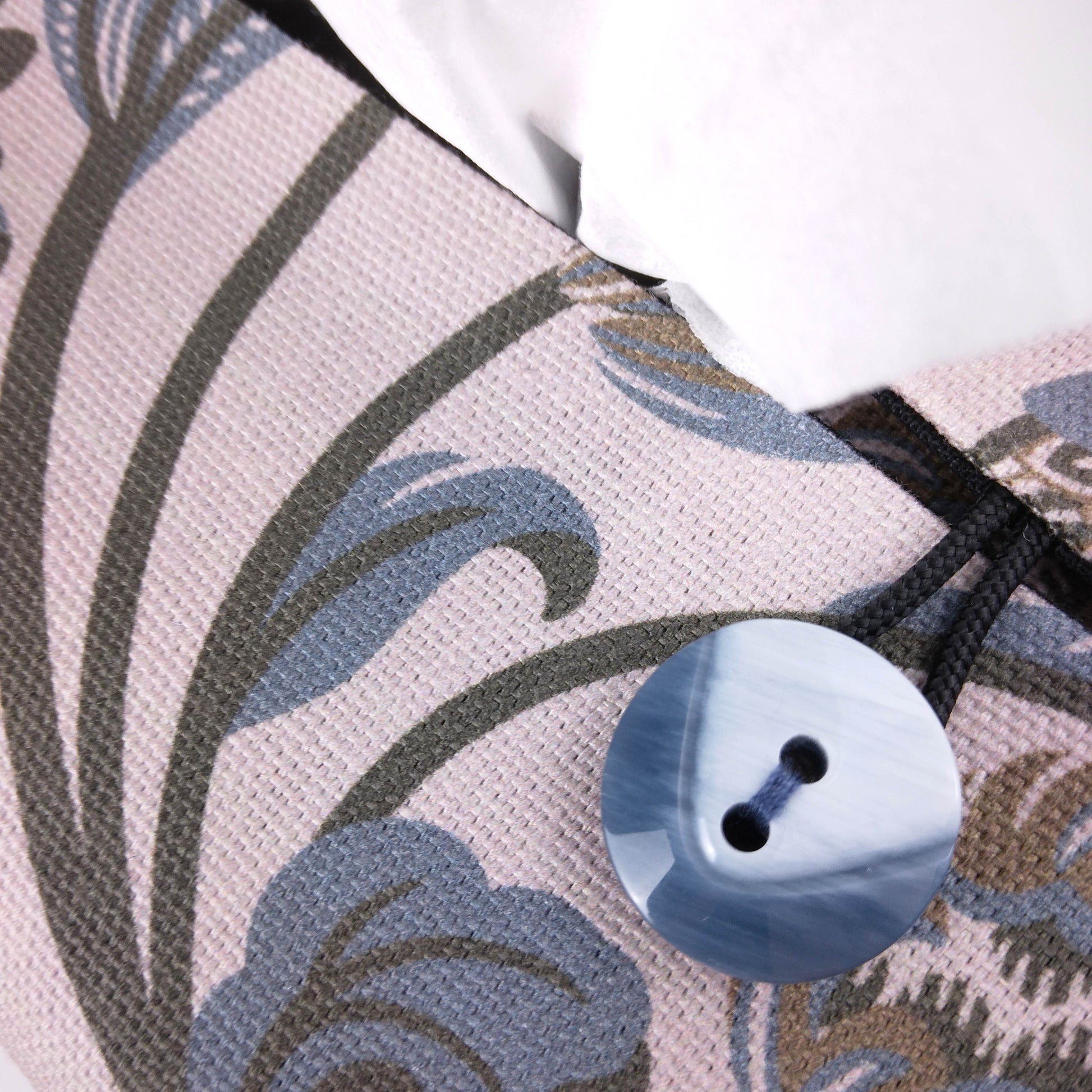 Close up view of cotton rectangle tissue box cover with buttons