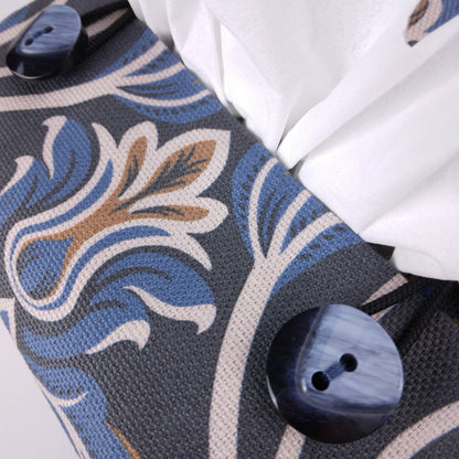 Close up view of square tissue box cover with buttons