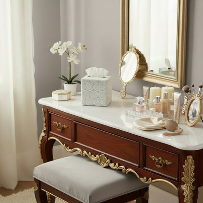Square tissue box cover sitting on a vanity table in a luxury home bedroom