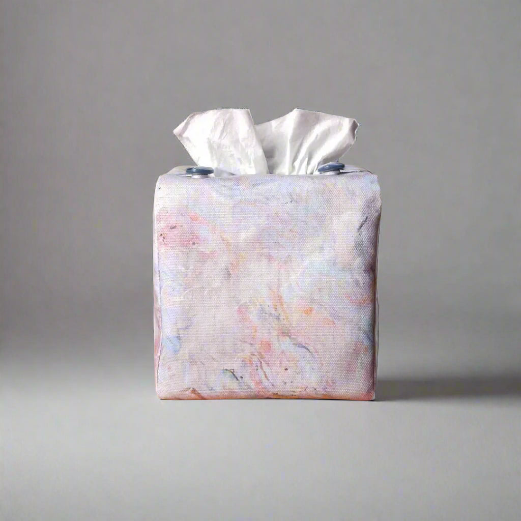 Square tissue box cover with white, orange, pink, blue and grey abstract pattern