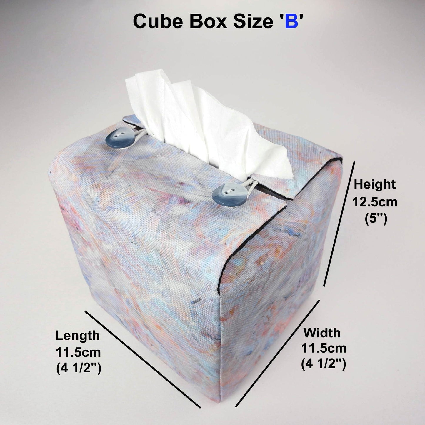 Square tissue box cover with white, orange, pink, blue and grey abstract pattern