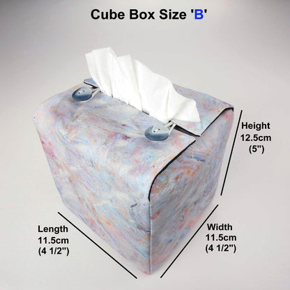 Square tissue box cover with white, orange, pink, blue and grey abstract pattern