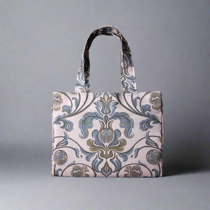 Mini tote bag with grey and brown baroque style floral design on taupe background