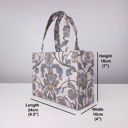 Mini tote bag with grey and brown baroque style floral design on taupe background