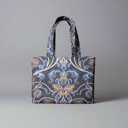 Mini tote bag with white, brown, and blue baroque style floral design on navy background
