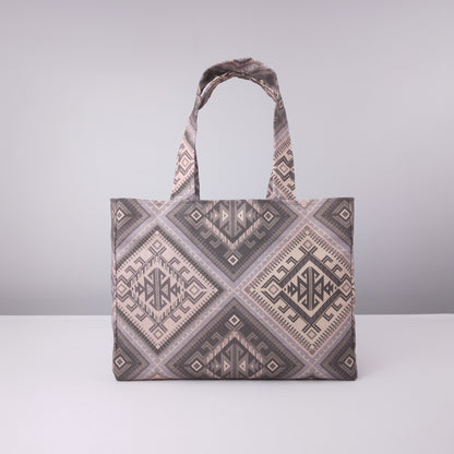 Front view of a mini tote bag with grey diamond kilim pattern
