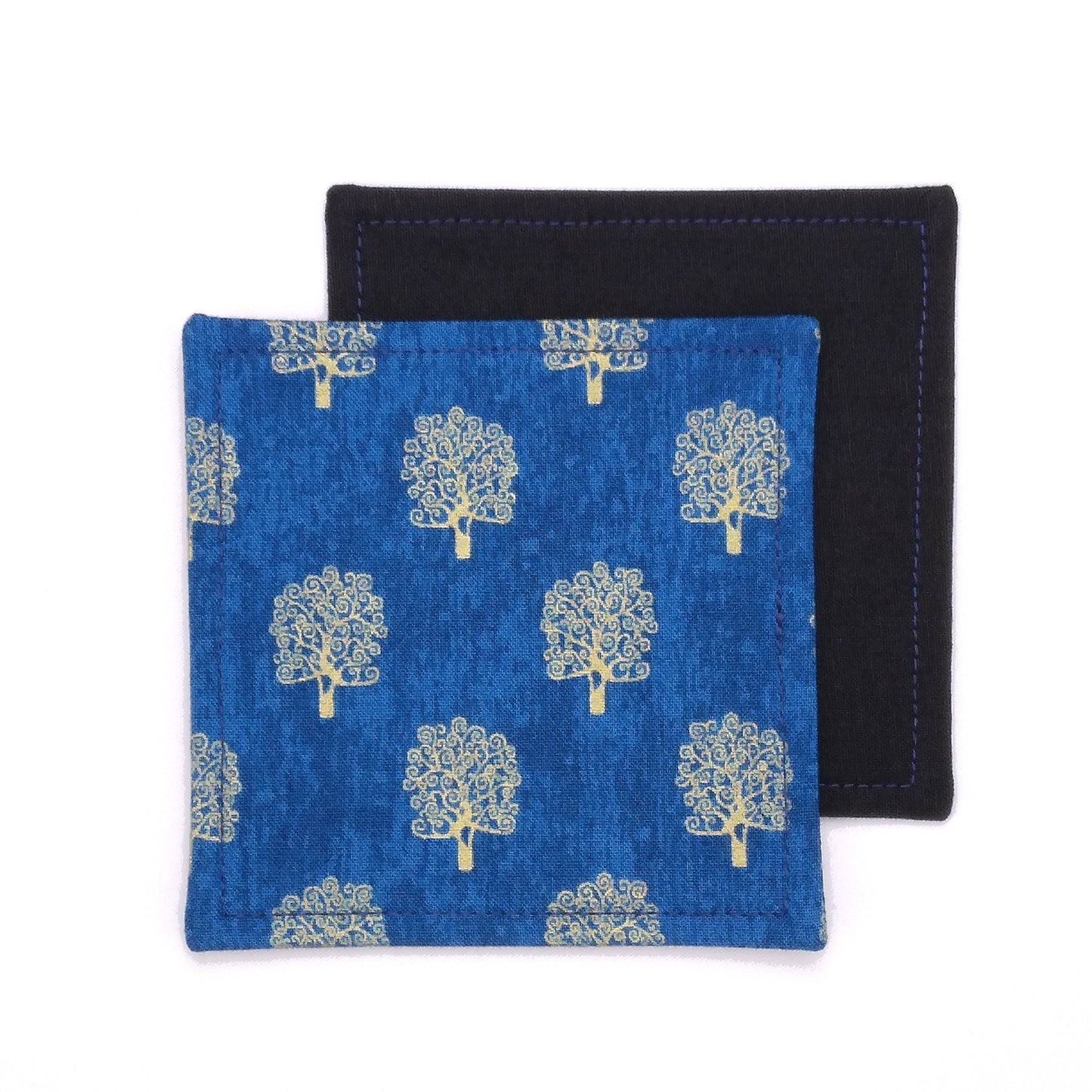 Square coasters with gold colour trees design on blue background