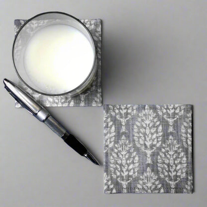 Square coasters with off white poplar trees design on grey background