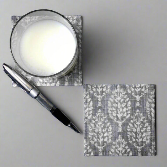 Square coasters with off white poplar trees design on grey background