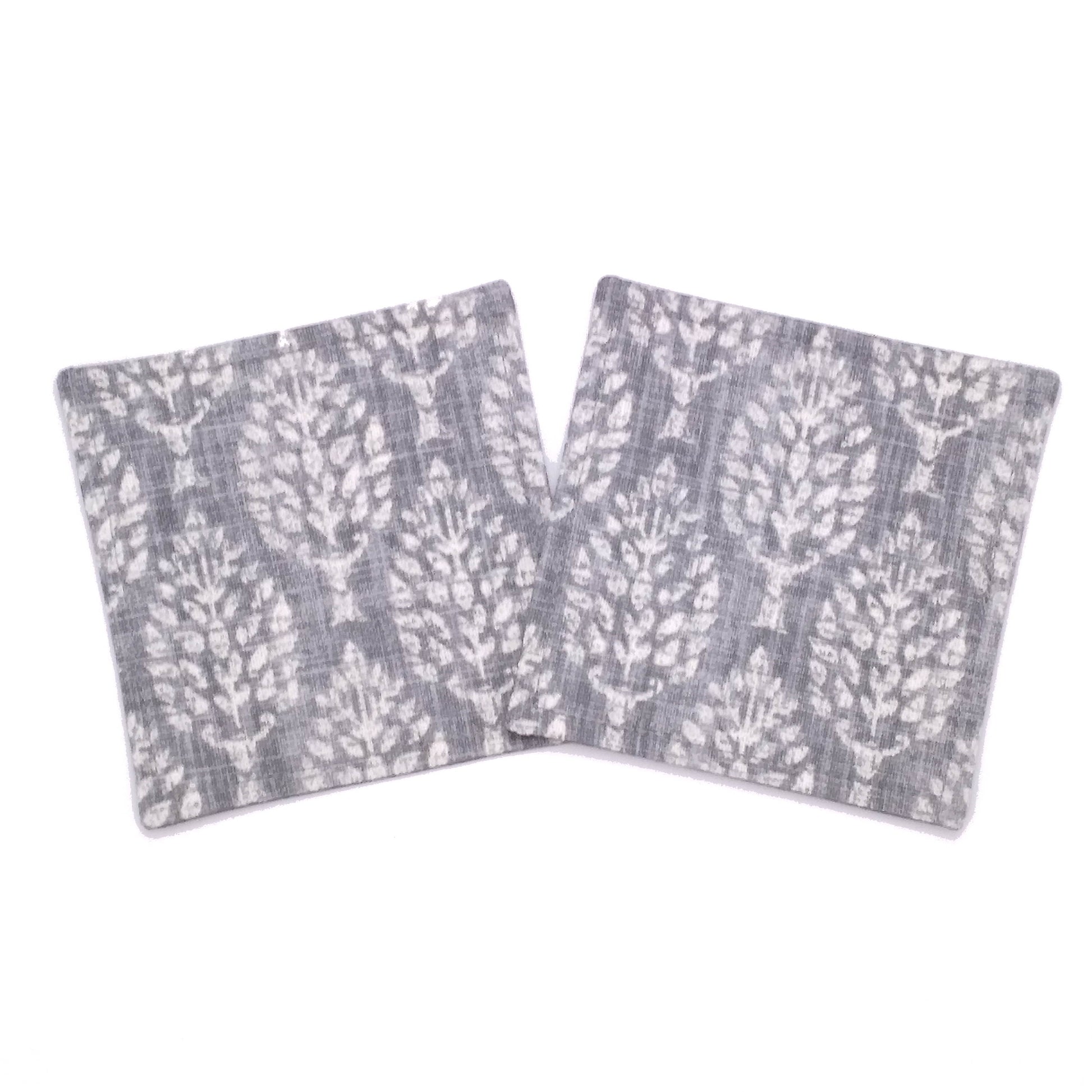 Square coasters with off white poplar trees design on grey background