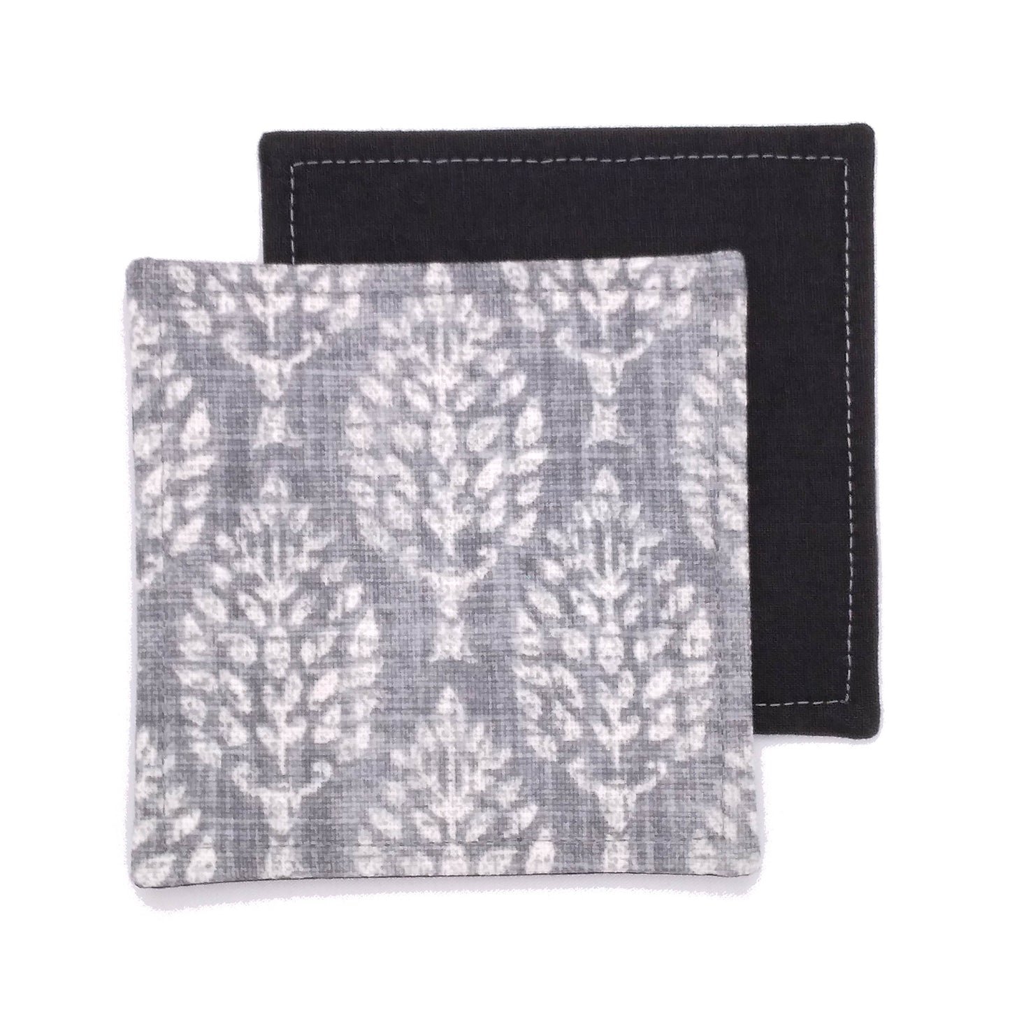 Square coasters with off white poplar trees design on grey background