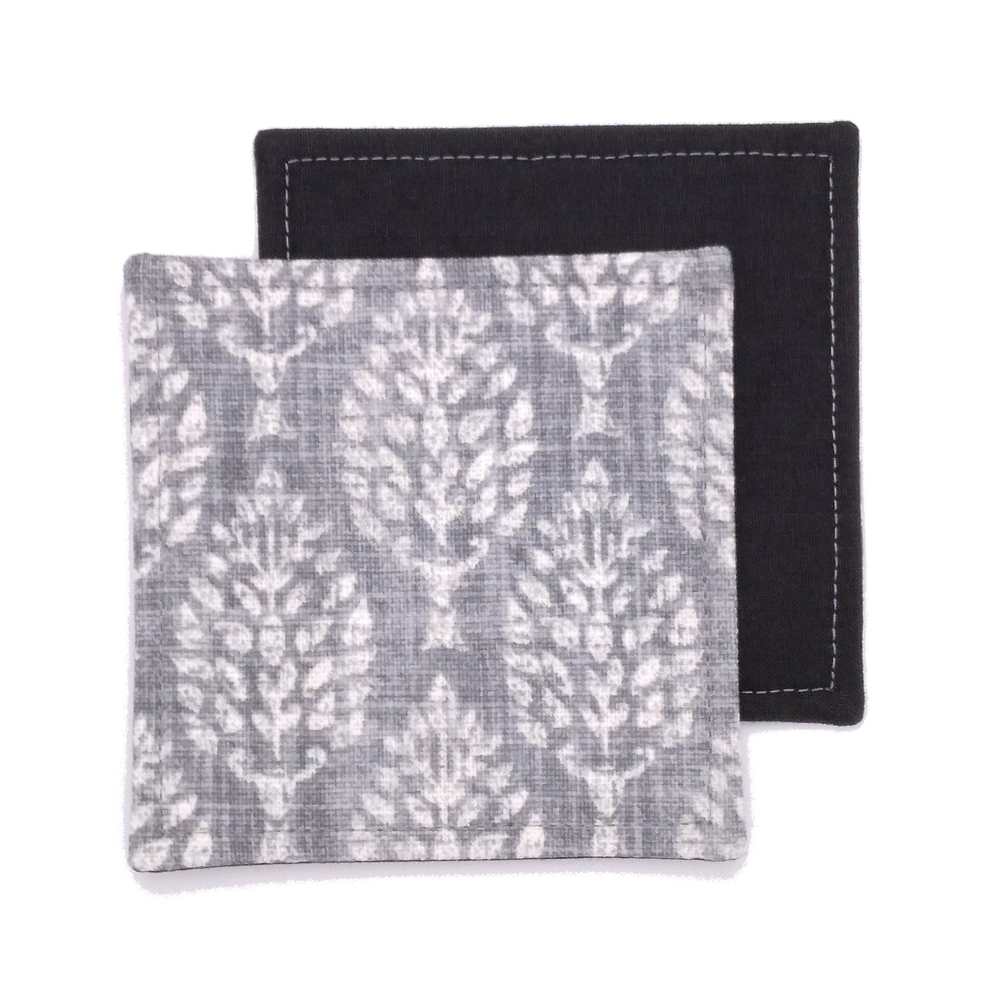 Square coasters with off white poplar trees design on grey background