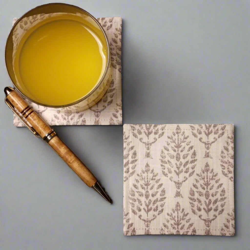 Square coasters with tan poplar trees design on natural colour background