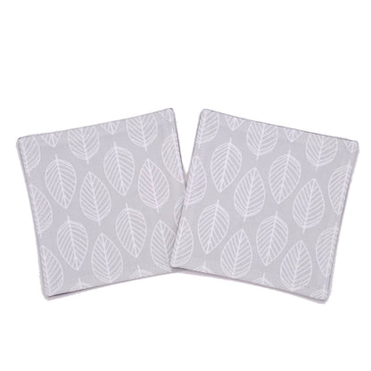 Square coasters with white leaf outline on grey background