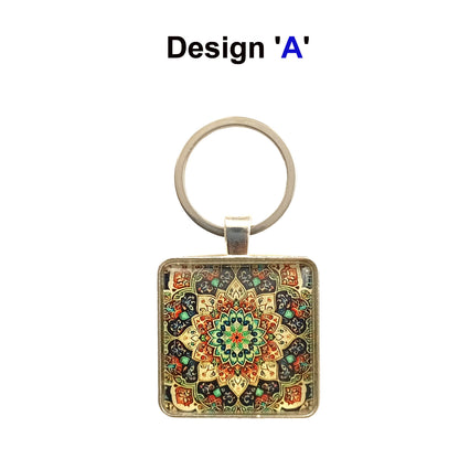 Square glass cabochon with multi colour mandala design set in a metal frame with stainless steel keyring