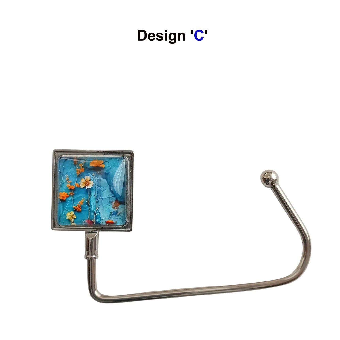 Handbag hook with glass cabochon and colourful blue and orange floral collage image, and metal hook