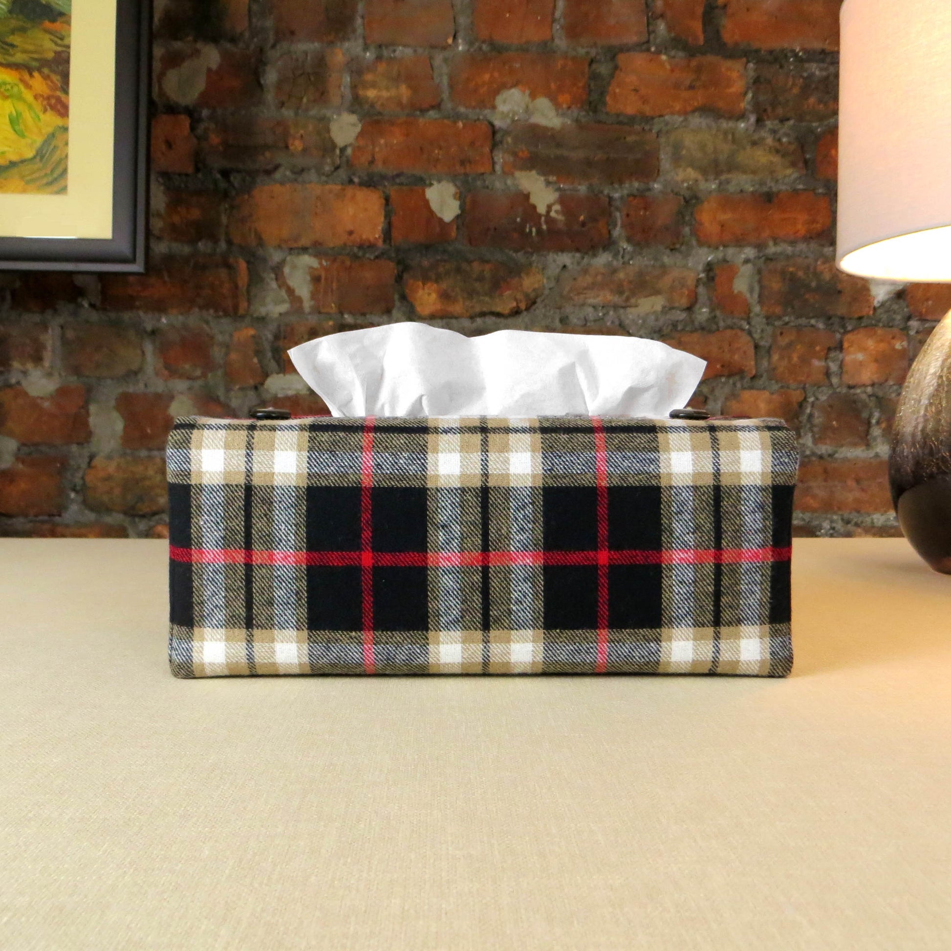 Woven brushed cotton rectangle tissue box cover with black and tan tartan pattern with a red stripe