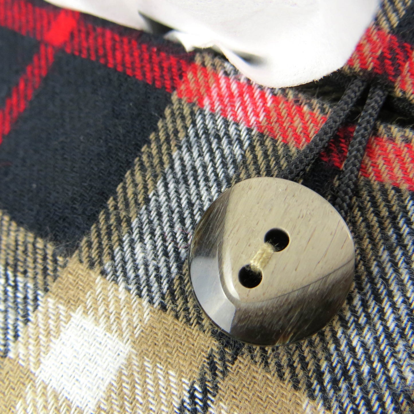 Woven brushed cotton rectangle tissue box cover with black and tan tartan pattern with a red stripe