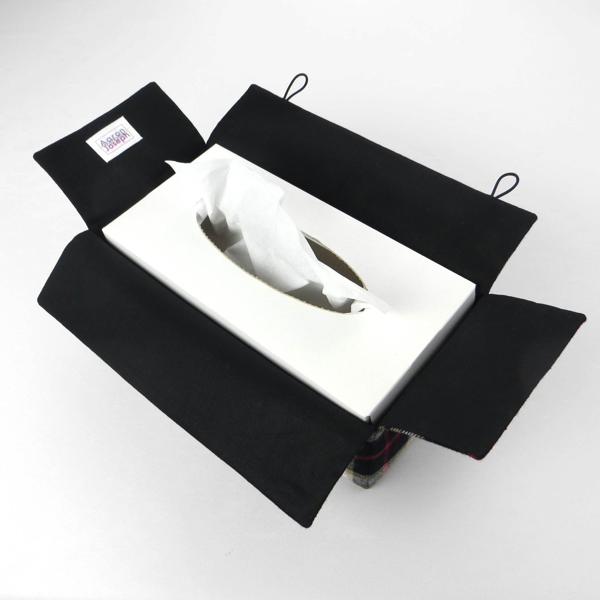 Woven brushed cotton rectangle tissue box cover with black and tan tartan pattern with a red stripe