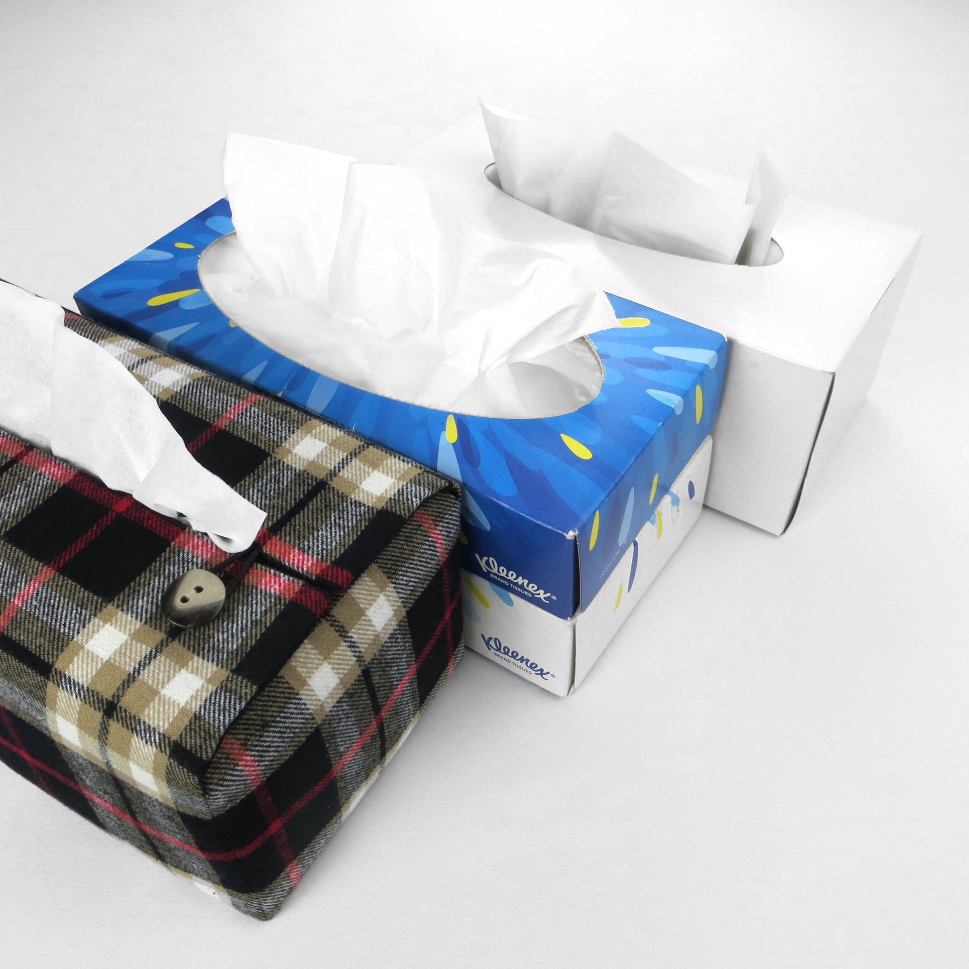 Woven brushed cotton rectangle tissue box cover with black and tan tartan pattern with a red stripe