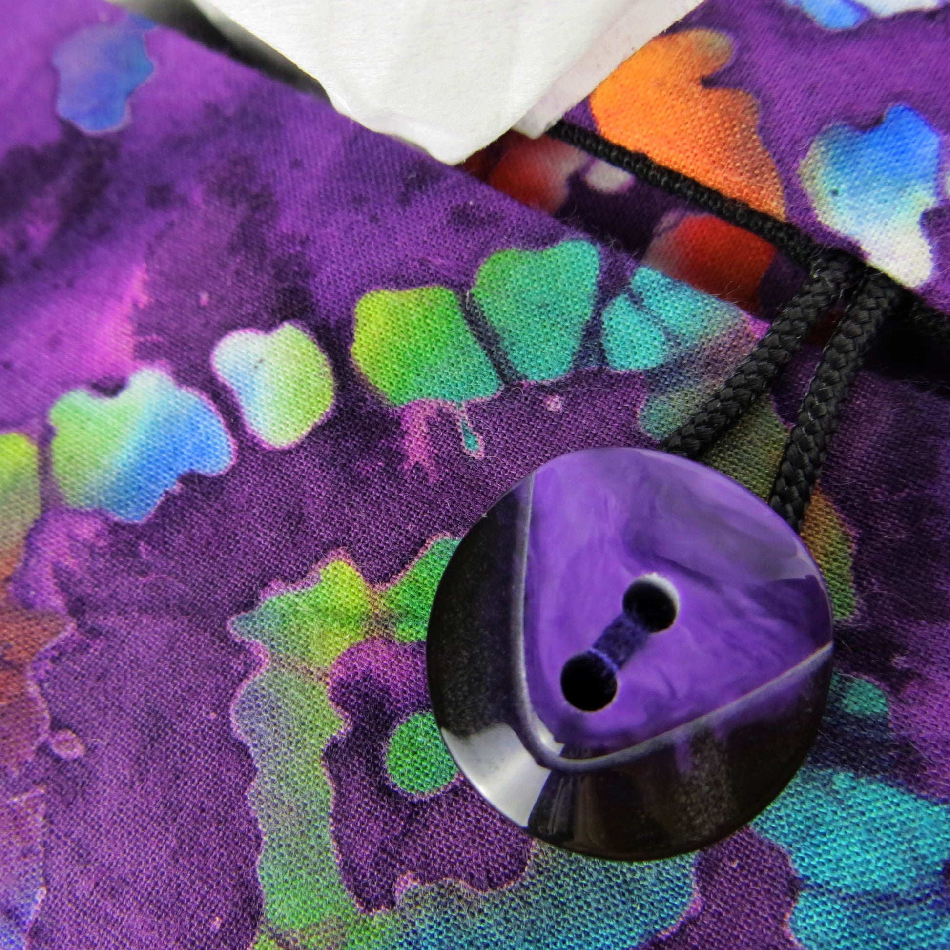 Batik printed cotton rectangle tissue box cover with tie dye multi colour diamond design on purple background