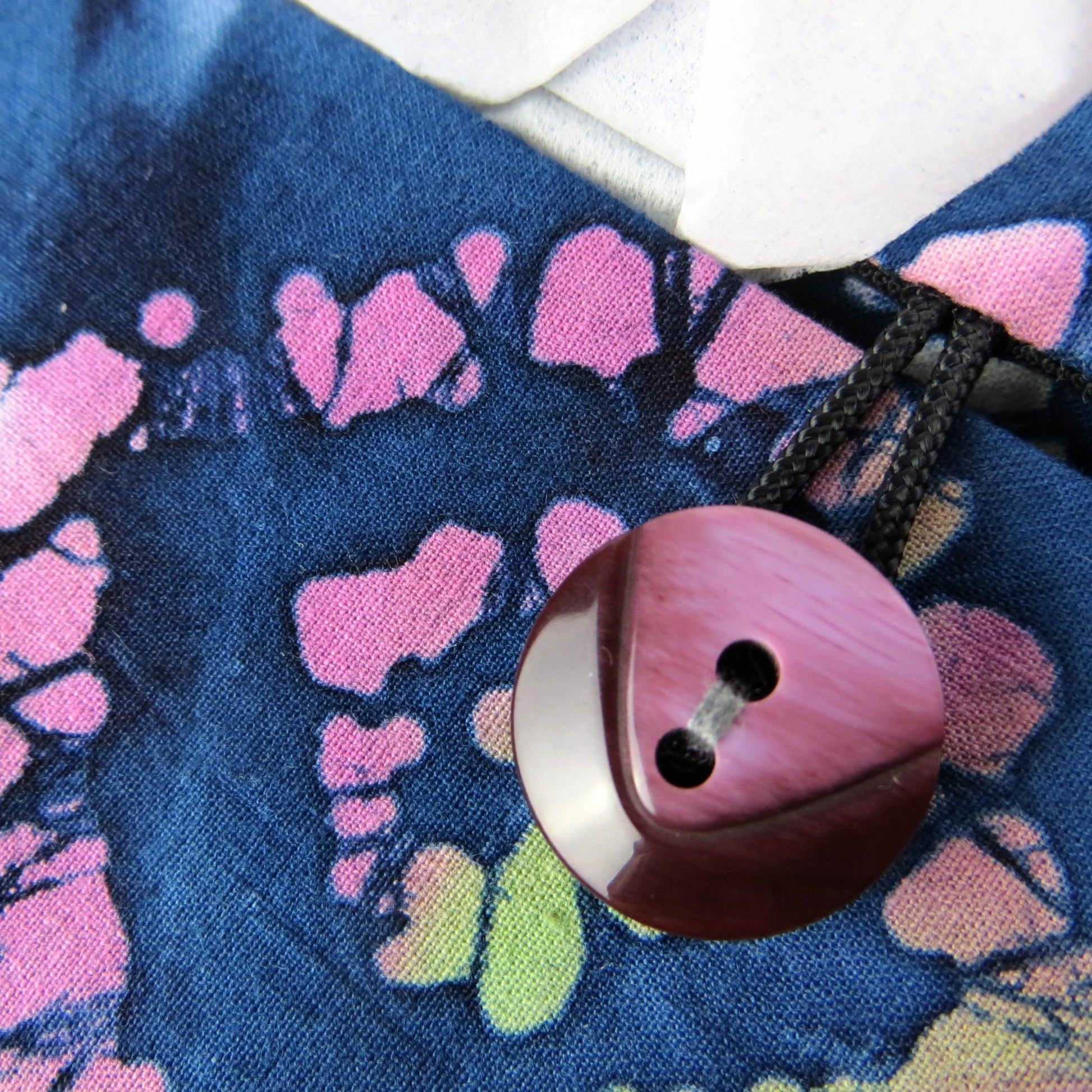 Batik printed cotton rectangle tissue box cover with tie dye magenta and green diamond design on blue background