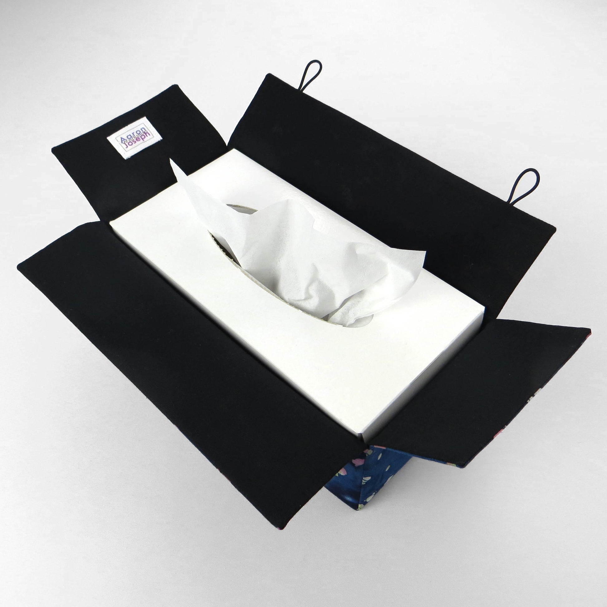 Batik printed cotton rectangle tissue box cover with tie dye magenta and green diamond design on blue background