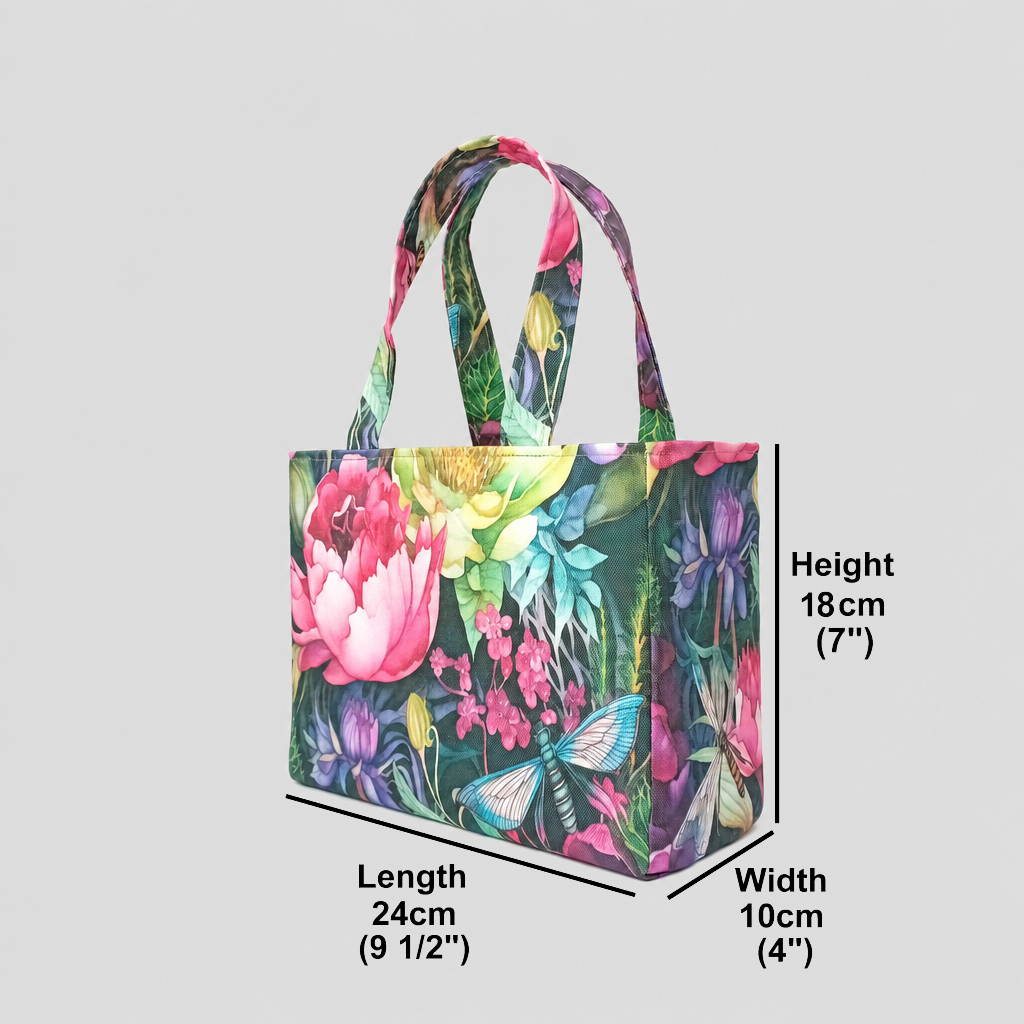 A handmade mini cotton tote bag with a vibrant, multicoloured floral and dragonfly print, featuring two top handles, and product measurements.