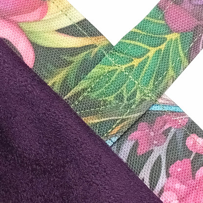 Close-up of a handmade mini cotton tote bag showing a dark purple velvet lining, with a floral print trim.