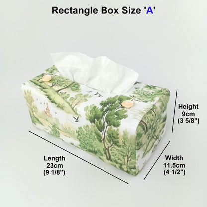 A handmade rectangular cotton tissue box cover with a green and beige woodland landscape print on an off-white  background, and product measurements.