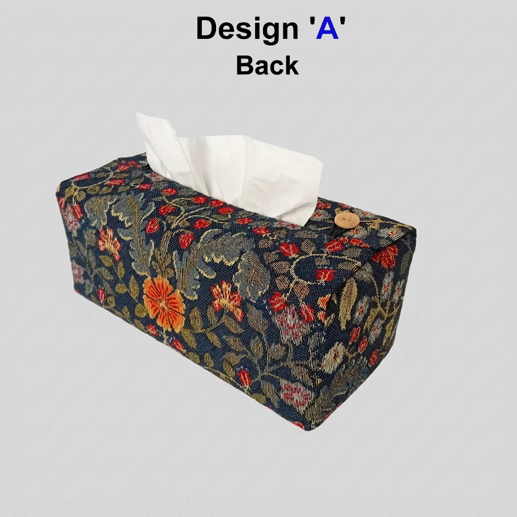 Reverse side of a rectangular tissue box cover with a dark navy blue background and an intricate floral pattern in red, orange, and green.