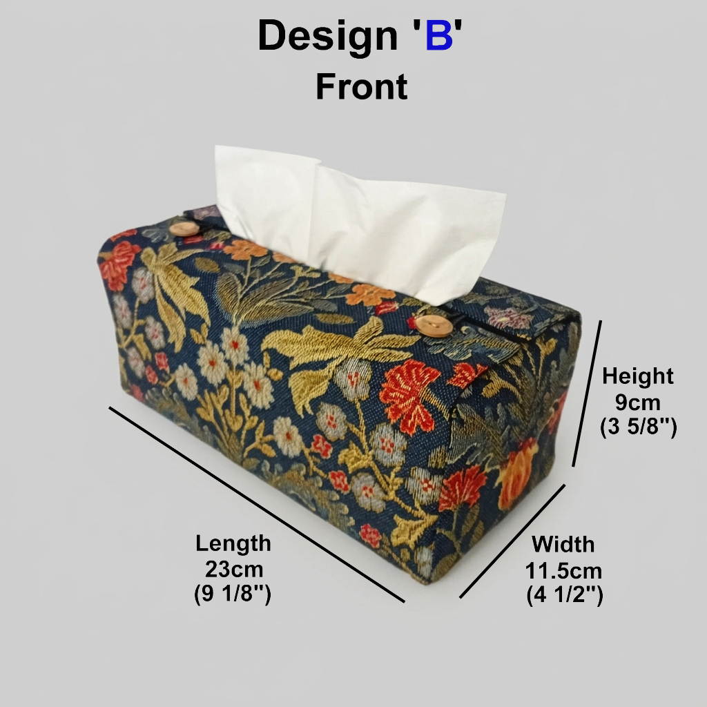 A handmade polycotton rectangular tissue box cover with a dark navy blue tapestry fabric and an intricate multicolour floral and leaf pattern in gold, red, and white, with product measurements.
