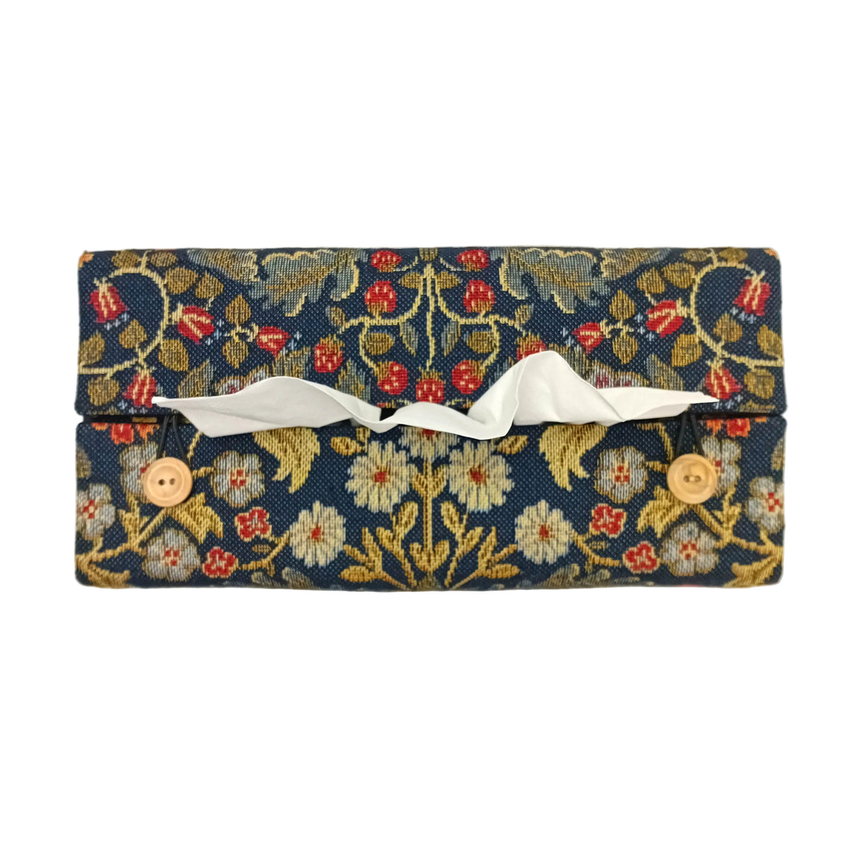 Top view of a rectangular tapestry fabric tissue box cover with a navy blue background and an intricate floral pattern in red, gold, and white, and two small wooden buttons.