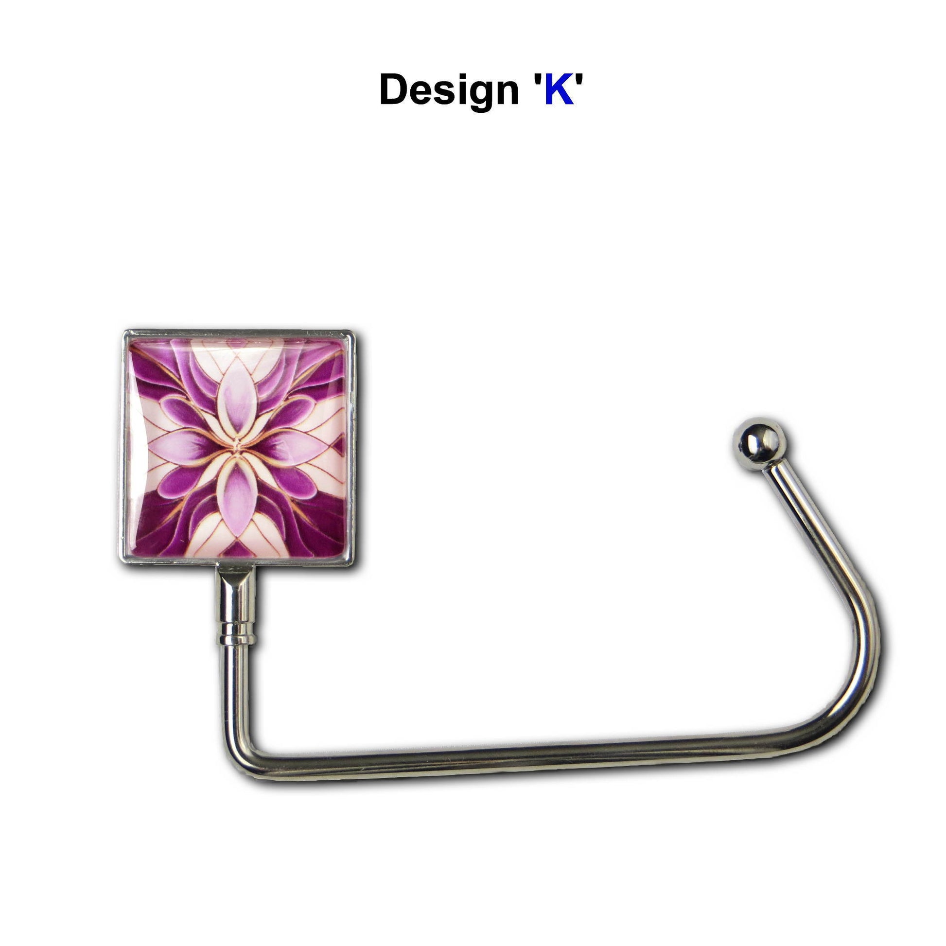 Handbag hook with glass domed image for hanging accessories on tables, ledges, and shelves