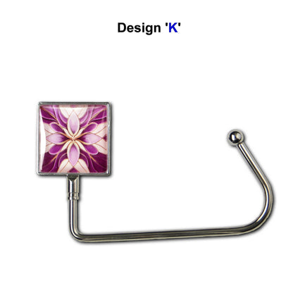Handbag hook with glass domed image for hanging accessories on tables, ledges, and shelves