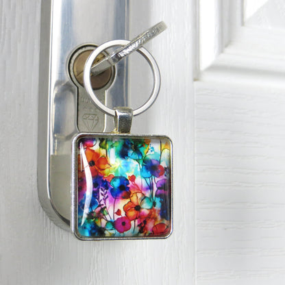Keyring with a colourful glass domed image