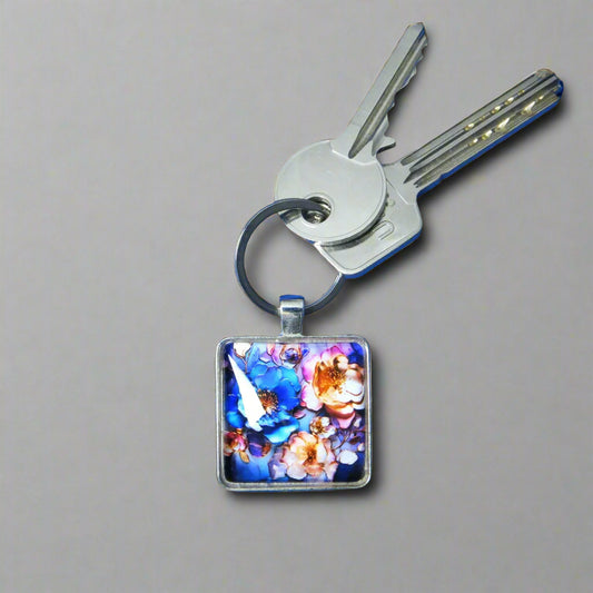 Keyring with a colourful glass domed image