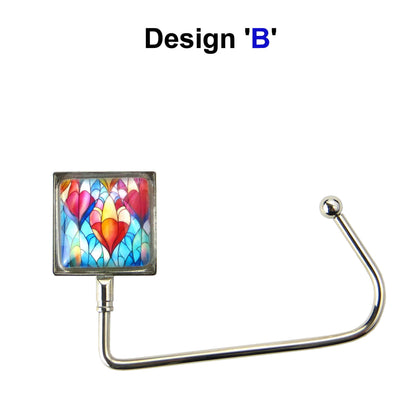 Handbag hook with a glass domed blue, red, and orange hot air balloon style image