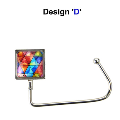Handbag hook with a glass domed blue, red, and orange jewel style image