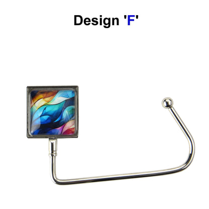 Handbag hook with a glass domed blue, pink, and yellow waves style image