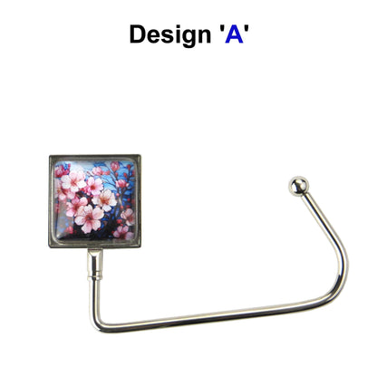Handbag hook with glass domed image for hanging accessories on tables, ledges, and shelves
