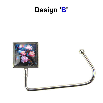 Handbag hook with glass domed image for hanging accessories on tables, ledges, and shelves