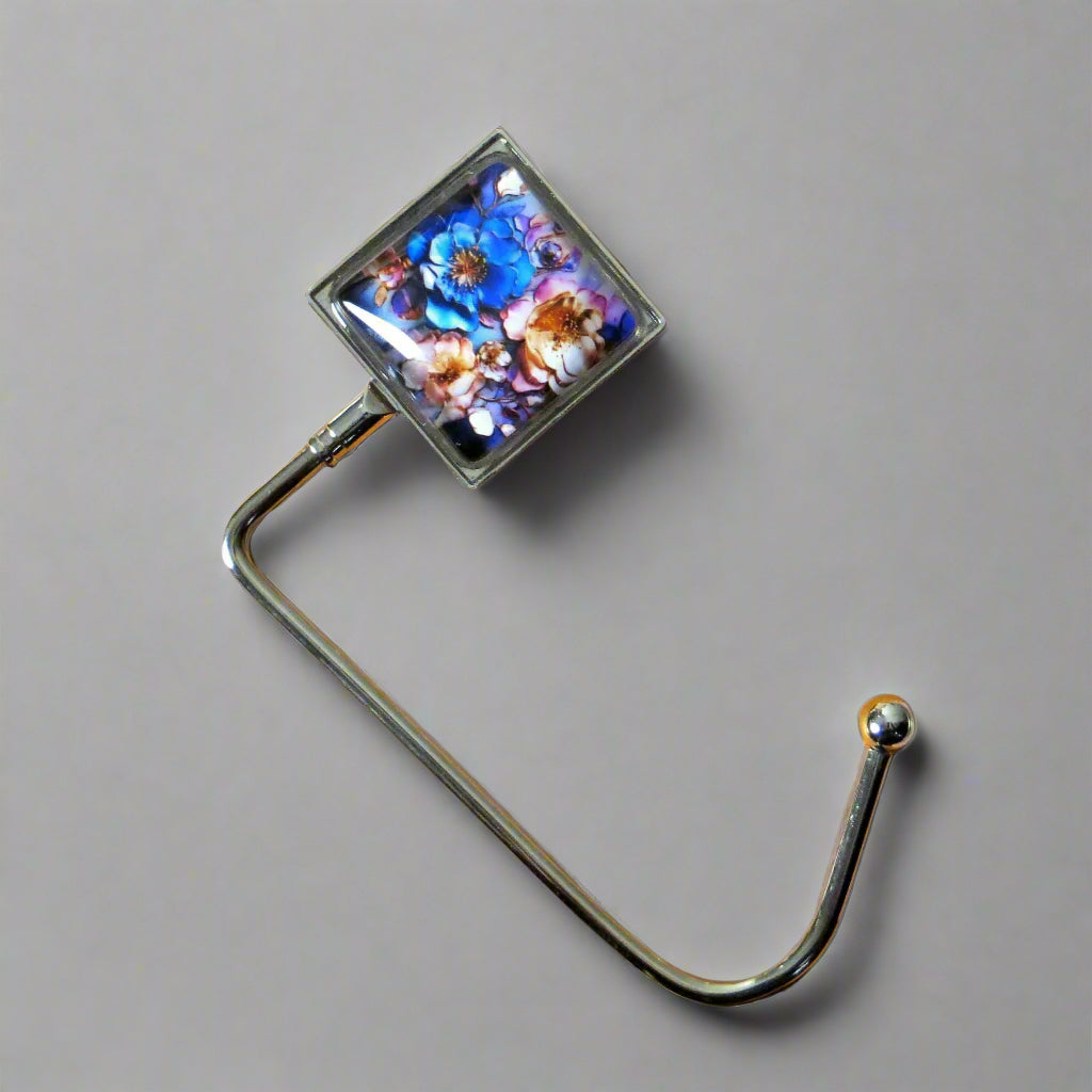 Handbag hook with glass domed image for hanging accessories on tables, ledges, and shelves