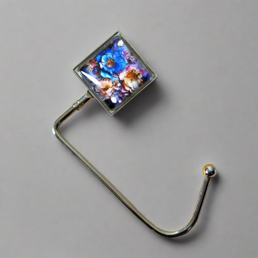 Handbag hook with glass domed image for hanging accessories on tables, ledges, and shelves