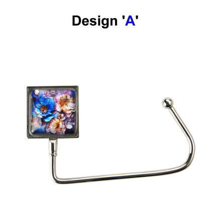 Handbag hook with glass domed image for hanging accessories on tables, ledges, and shelves