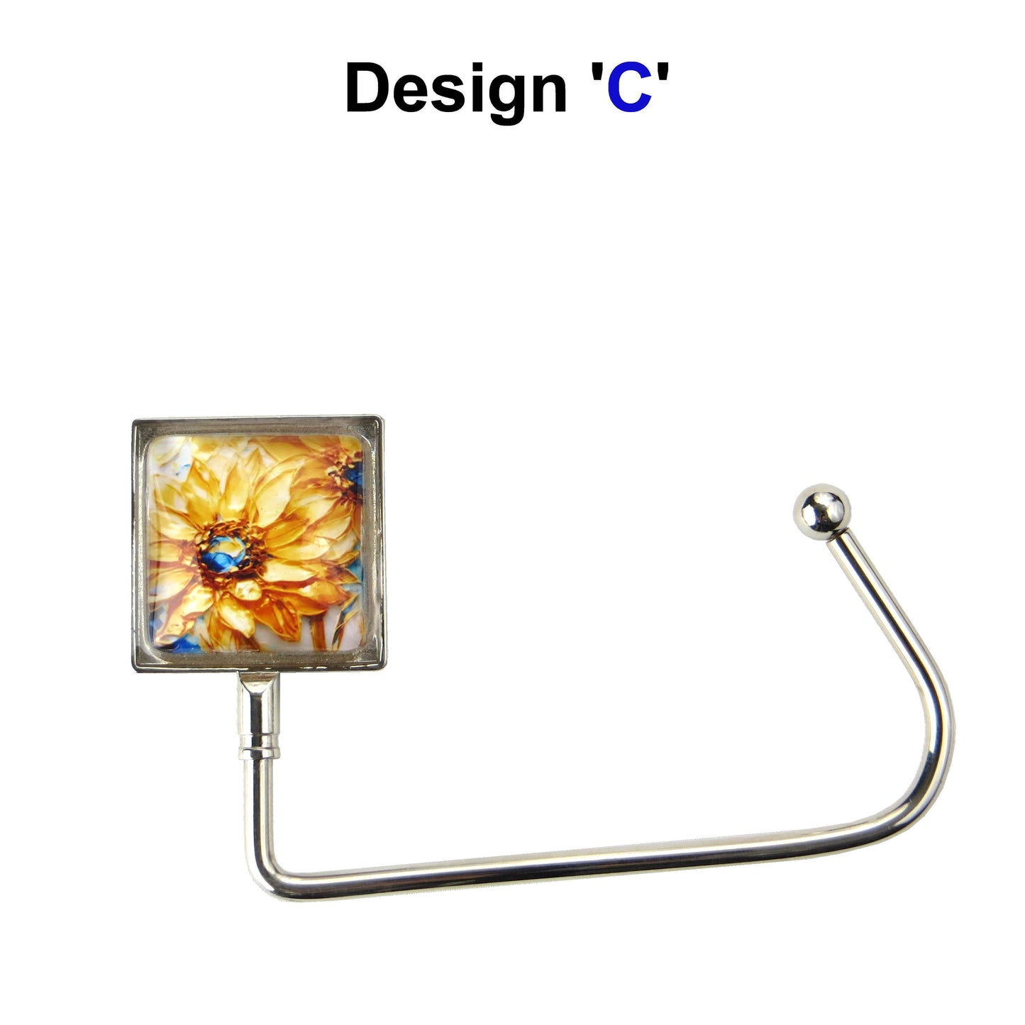 Handbag hook with glass domed image for hanging accessories on tables, ledges, and shelves