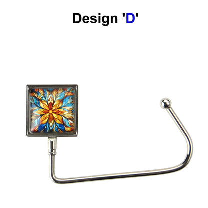 Handbag hook with glass domed image for hanging accessories on tables, ledges, and shelves