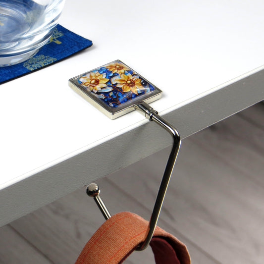 Handbag hook with glass domed image for hanging accessories on tables, ledges, and shelves