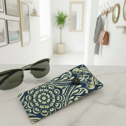 Soft padded eyeglass pouch with sunglasses on a marble table in a modern decorated home hallway