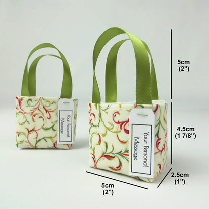 Pair of miniature fabric tote bag style decorations with product details